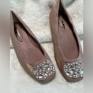 Pink flats with pearls and rhinestones.